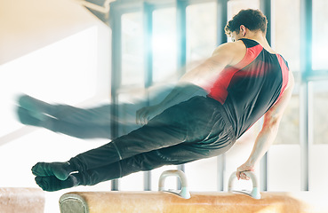 Image showing Fast, gymnastics and movement with man on beam, sports and exercise for fitness, wellness and training for competition. Male, guy and athlete in gym, practice speed and balance for routine and health