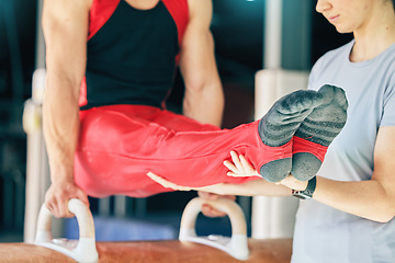 Image showing Sports, gymnastics and man training on a beam with a coach for balance, flexibility and strength. Fitness, exercise and strong male athlete gymnast practicing for performance or competition at arena.