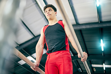 Image showing Gymnastics, fitness and man training in a studio for a competition, performance or show. Sports, athlete and male gymnast practicing for flexibility, agility or strength for balance at event in arena