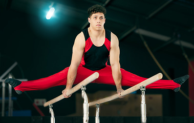 Image showing Fitness, gymnastics and man stretching, concentration and training for wellness, healthy lifestyle and sports. Male, gymnast and athlete stretch, focus or practice for balance, performance or workout