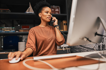 Image showing Telephone, office and business woman on computer working on corporate project while on call. Professional, career and African female employee doing research on desktop for company report in workplace