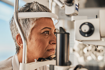 Image showing Optometry, slit lamp and eye exam by senior woman or patient with medical insurance using machine. Ophthalmology, eyesight and female test vision in clinic as eyecare during consultation