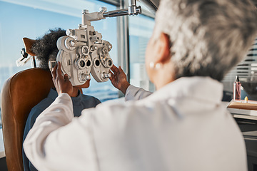 Image showing Optometry, eyecare and optician doing a eye test for a patient for vision or healthcare in a clinic. Ophthalmology, medical and female optometrist doing exam for prescription lenses in optical store.