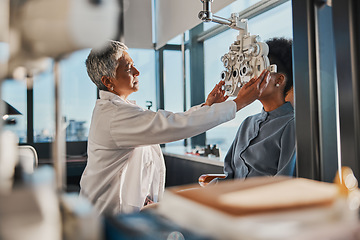 Image showing Elderly optometrist woman, eye exam patient and medical goal in hospital, consulting room and office with help. Senior optician, eyesight test and phoropter for wellness, health and vision analysis