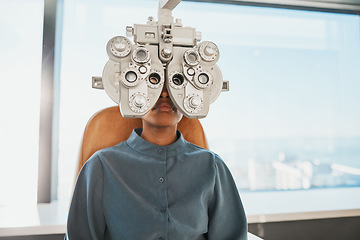 Image showing Optometry test, eye exam and black woman in clinic for testing, eyesight and optical assessment. Healthcare, optometrist consultation and patient with medical equipment, phoropter and lens for eyes