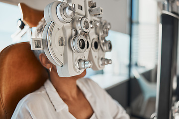 Image showing Healthcare test, eye exam and woman in optometry clinic for vision, eyesight and optical assessment. Glasses, optometrist consultation and patient with medical equipment, phoropter and lens for eyes
