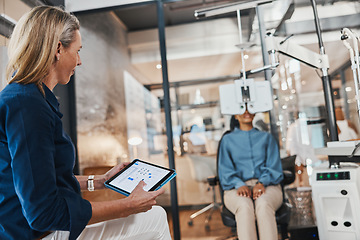 Image showing Eye exam, woman doctor tablet and consulting optometrist with patient at clinic. Eyes wellness worker, healthcare and vision exam with tech and digital results from glaucoma consultation machine