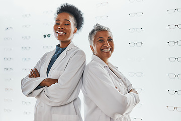 Image showing Optometry, healthcare and portrait of optometrists in a clinic after optic consultation or eye test. Leadership, ophthalmology and team of women opticians standing with crossed arms in optical store.