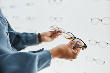 Image showing Glasses choice, black woman hands and customer with store worker at optician looking at lens. Eye consulting, smile and eyewear shopping in a frame shop for vision and prescription exam for eyes