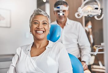 Image showing Portrait, happy and dental with a woman patient in a doctor office for oral hygiene or health. Smile, teeth and healthcare with a senior female sitting in a chair at the dentist for hygiene