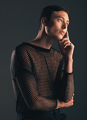 Image showing Gender neutral person, fashion and thinking on dark background, trendy and edgy art. Creative, gen z and beauty, queer and sexy with cosmetics, contemplating with non binary and designer clothes