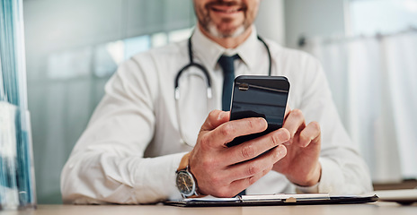 Image showing Healthcare, hospital and hands of doctor with phone for social media, research and online consulting. Communication, insurance and man with smartphone for wellness app, medical data and telehealth