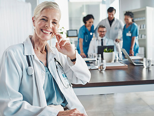 Image showing Healthcare, smile and leadership, portrait of woman doctor at desk in hospital for support, teaching and medical students. Health, medicine and confident, mature and happy mentor with stethoscope.