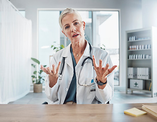 Image showing Senior woman, doctor and video call in hospital for online consultation and telehealth. Portrait, healthcare and female medical physician consulting or asking question in virtual meeting for wellness