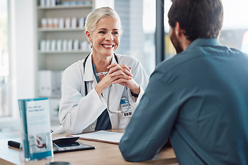 Image showing Consultation, doctor and patient talking with woman in hospital for doctors appointment. Healthcare, wellness and man consulting happy senior medical professional for health advice or help in clinic.