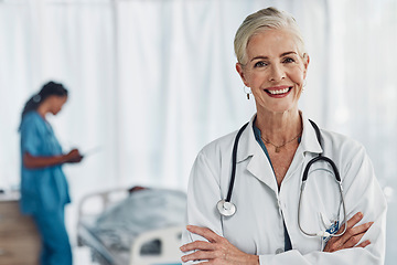 Image showing Leadership, smile and portrait of senior woman doctor in hospital with confidence and success in medical work. Health, medicine and face of confident mature professional with stethoscope and mockup.