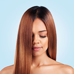 Image showing Beauty, hair care and face of woman with eyes closed in studio isolated on a blue background. Makeup cosmetics, wellness and young female model with salon treatment for growth, hairstyle or balayage.