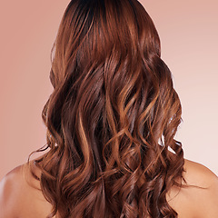 Image showing Beauty, back and hair care of woman in studio isolated on a red background for haircare. Curly hairstyle, keratin cosmetics and female model with salon treatment for growth, texture and balayage.