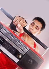 Image showing Closeup, retro radio and black man with music, makeup and fashion against grey studio background. Zoom, boom box and cassette player with queer male, gay and transgender person with sounds and music