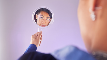 Image showing Makeup, reflection and gay man with mirror in hand with pride on purple background. Cosmetics, aesthetic and art, lgbt fashion model face with beauty in studio, non binary and gender neutral skincare