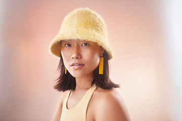 Image showing Asian woman, fashion and cosmetics with gen z and portrait, yellow aesthetic and edgy on studio background. Streetwear, beauty and makeup with style, female face and mockup space with fog or smoke