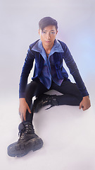 Image showing Makeup, portrait of gay man on floor in fashion and pride in Indonesia isolated on purple background. Confidence, aesthetic and lgbt model with beauty in studio, non binary and gender neutral design.