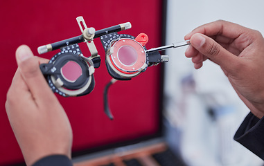 Image showing Hands, trial frame and optometry, lens and test, vision and glasses with ophthalmologist tools, healthcare for eyes. Optometry, eye care and optometrist person, medicine and chart with measurement
