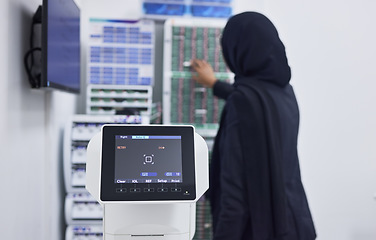 Image showing Optometry, screen for eye exam and Muslim optician with machine for vision test, eyesight and optical assessment. Healthcare, ophthalmology and optometrist working on medical camera for eyes scan