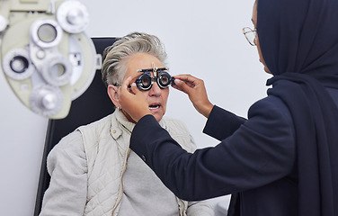 Image showing Eye exam, glasses and senior woman with optometrist in clinic for testing eyes, check eyesight and optical care. Vision, healthcare and Muslim optician with patient, optometry and medical tools