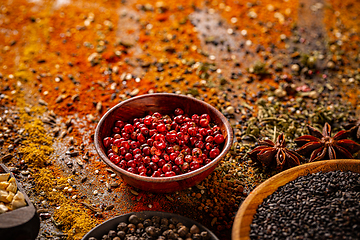 Image showing Red peppercorn in wooden bowl
