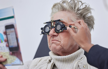 Image showing Vision, trial frame and woman for eye exam in optometry clinic for test, eyesight and optical assessment. Ophthalmology, health and elderly patient reading with optician, optometrist and glasses