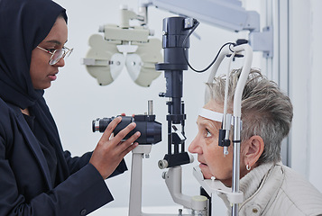 Image showing Eye exam, optometrist and senior woman in clinic for test, eyesight and ophthalmology assessment. Optometry, optical healthcare and Muslim optician with patient for testing, medical lens and glasses