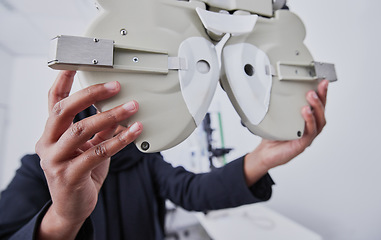 Image showing Optometry, machine and optometrist preparing for a eye test in the optic or healthcare clinic. Vision, ophthalmology and hands of a female optician with optical equipment for a exam in a store.