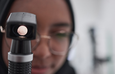 Image showing Eye exam, consulting and medical with muslim woman optometry tool for healthcare, vision and microscope for you. Ophthalmology, wellness and glaucoma test with girl and retinoscope for treatment