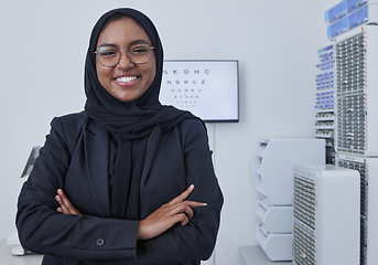 Image showing Hijab, muslim woman portrait and optometrist in a doctor office ready for eye test with chart. Healthcare, eyes wellness and proud clinic worker with a smile with company vision and success