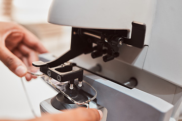 Image showing Hands, glasses and equipment with an optometrist in the office to configure prescriptions lenses from above. Eyewear, healthcare and medical with a doctor at work to adjust new frame spectacles