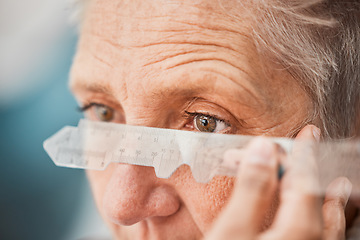 Image showing Eyes, vision and healthcare with a senior woman testing her eyesight for prescription lenses for focus. Medical, blind and consulting with a female patient at the optician to measure for glasses
