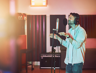 Image showing Musician, microphone or singing in studio for album recording, theatre night performance or radio industry. Man, singer or artist with headphones for production, theater melody or jazz karaoke media