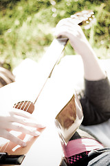 Image showing Girl Playing a Guitar