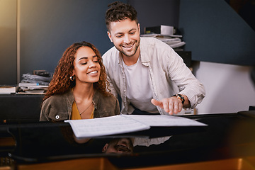 Image showing Artists, piano and people playing music in a creative or recording studio with a song book. Art, musicians and couple in production writing of album or sound track together with a musical instrument.