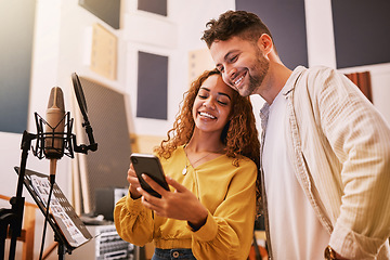 Image showing Man, woman or phone in recording studio for song lyrics, podcast ideas or album cover art in production booth. Smile, happy or musician on mobile technology for friends, singer or media collaboration