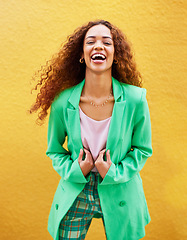 Image showing Portrait, fashion and woman laughing on yellow background, color wall and backdrop with smile in Colombia. Happy young female, trendy style and green clothes for beauty, curly hair and gen z model