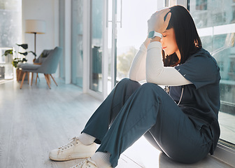 Image showing Nurse, depression and woman with stress in hospital after loss, grief or bad news in clinic. Mental health, healthcare and sad female medical physician with burnout, anxiety or headache after nursing