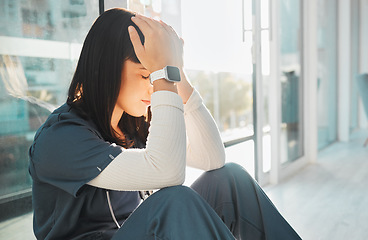 Image showing Nurse, stress and woman with depression in hospital after loss, grief or mistake in clinic. Mental health, healthcare and sad female medical physician with burnout, anxiety or headache after nursing.