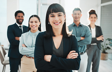 Image showing Portrait, collaboration and leader with a manager woman and her team standing arms crossed in the office. Vision, teamwork or diversity and a female manager posing at work with her employee group