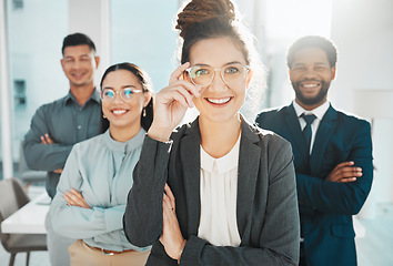 Image showing Portrait, teamwork and leadership with a manager woman and her team standing arms crossed in the office. Vision, collaboration or diversity and a female leader posing at work with her employee group