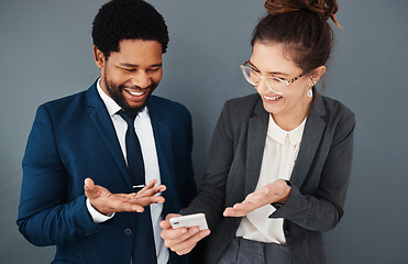 Image showing Phone, business people and friends laughing in office on social media, texting or web browsing. Technology, comic or coworkers, black man and woman with mobile smartphone laugh at funny internet meme