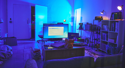 Image showing Programming room, information technology or tv in house for software, hacking or coding in neon light at night. It, television or living room interior with digital devices, sofa or piano with screen.