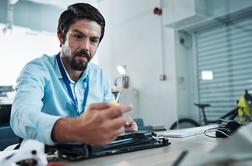 Image showing Laptop, repair and screwdriver with an engineer or handyman fixing hardware in an IT office. Computer, information technology and maintenance with a male service professional at work on technology