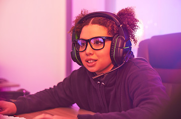 Image showing Video games, young girl and headset in home for esports, online rpg and virtual competition. Female gamer, computer streamer and gaming with headphones in neon lighting, live streaming tech and gen z